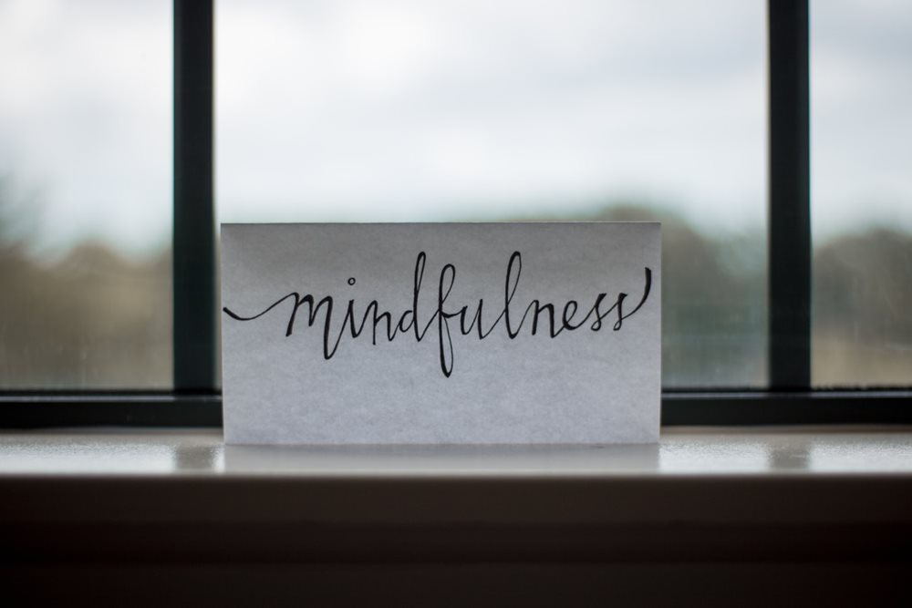 Paper with 'Mindfulness' written on it, in the window.