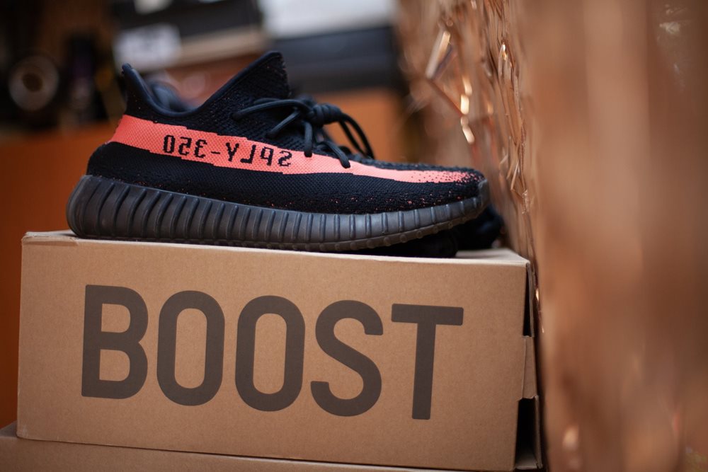Sneakers on box, that reads "BOOST".