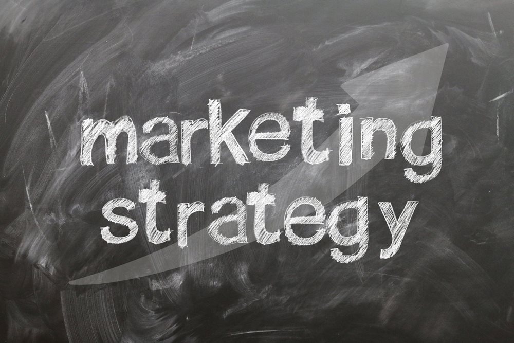 "Marketing strategy" written on a blackboard.