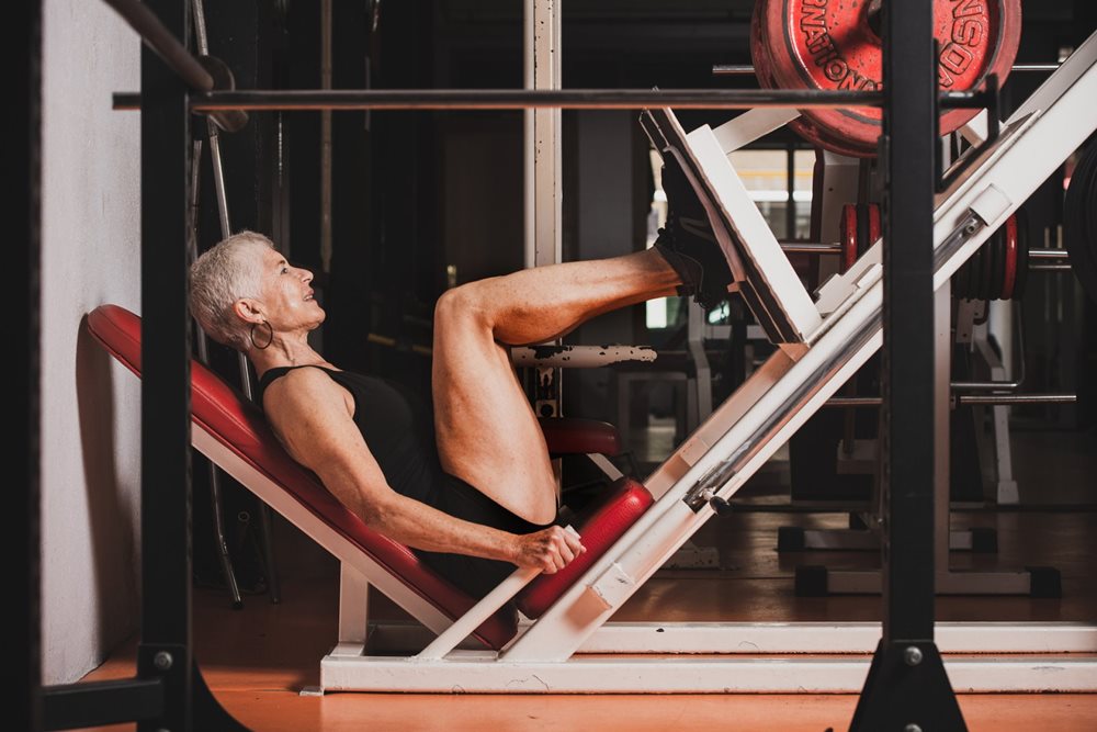 Woman doing leg presses.