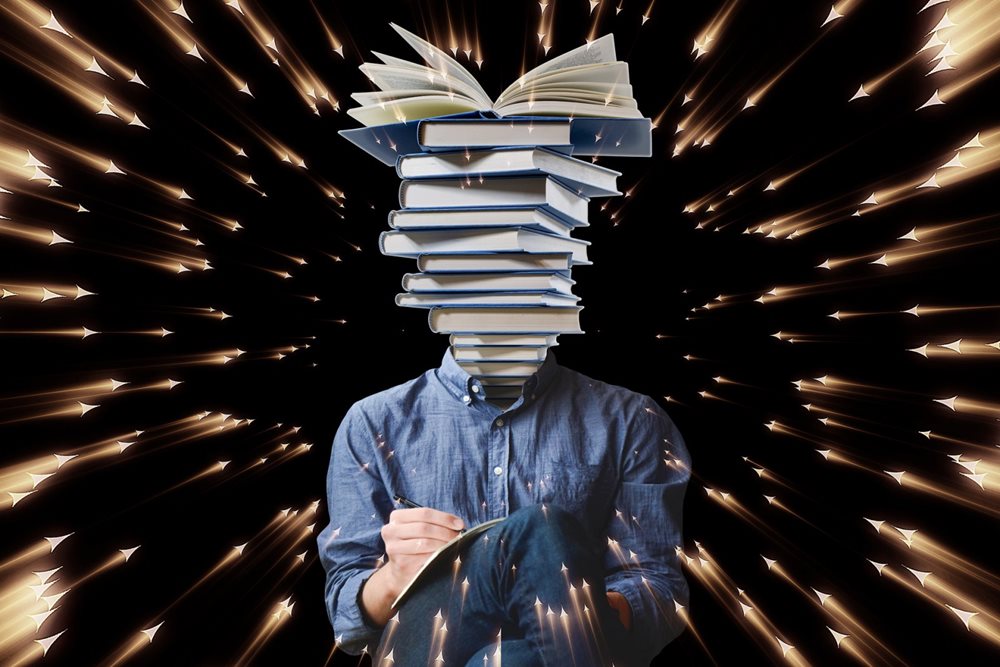 Man with head that is made of stack of books.