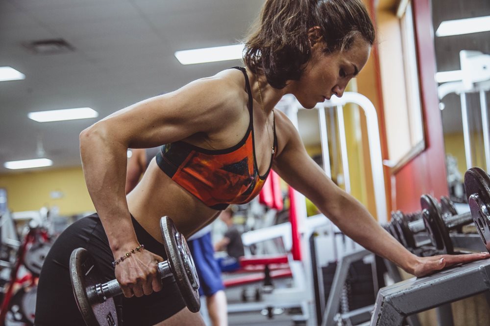 Woman doing a dumbbell exercise.