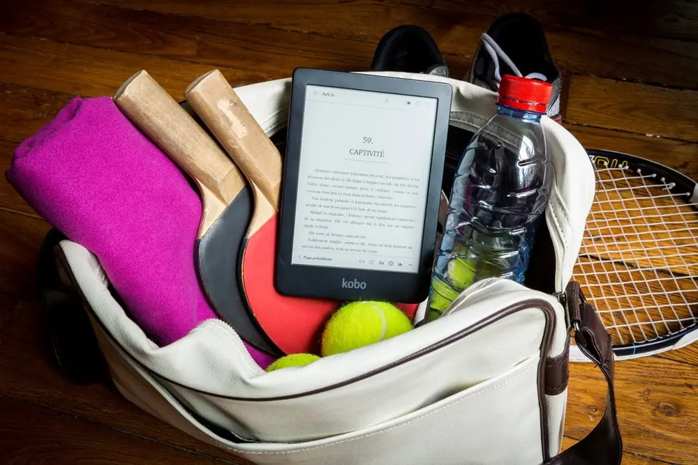 Bag with ping pong paddles and Kobo eReader.