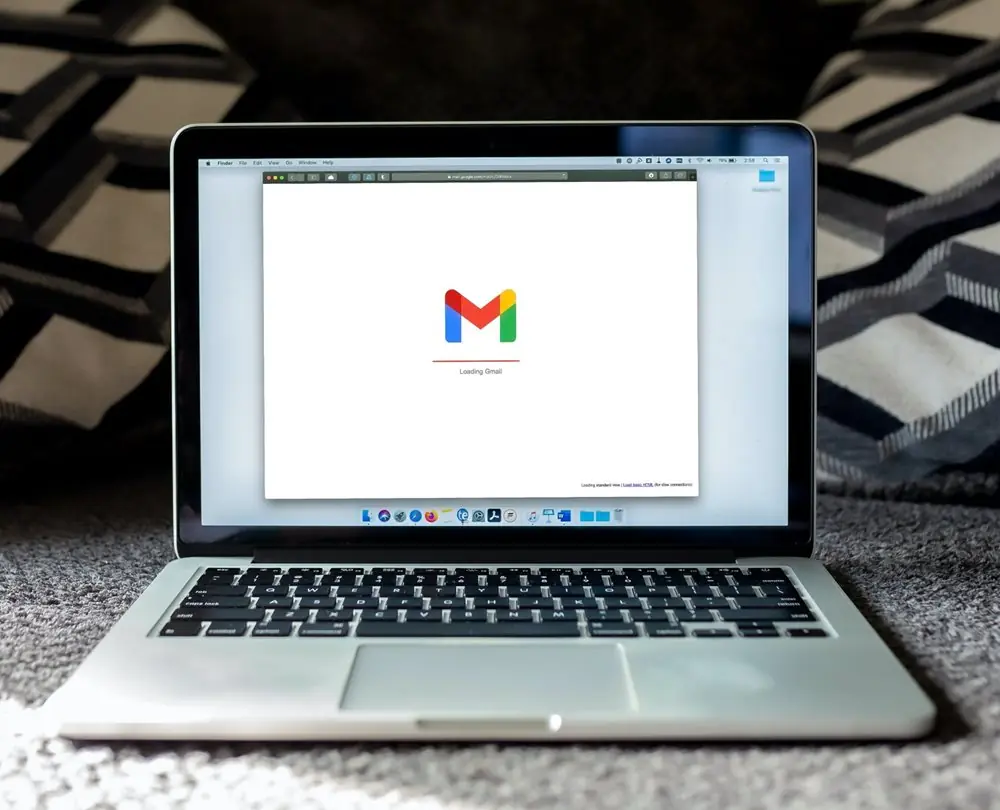 Laptop with Gmail loading on it.