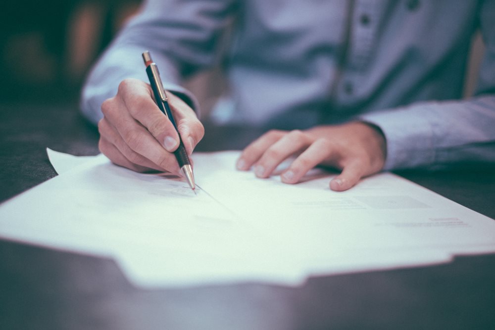 Man writing on papers.