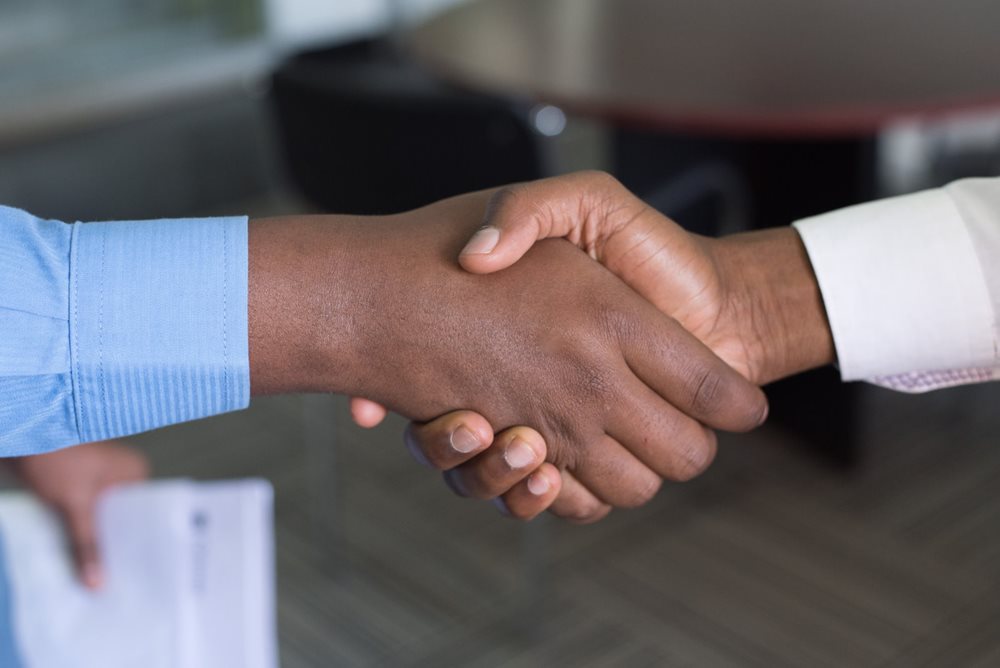 Two men shaking hands.