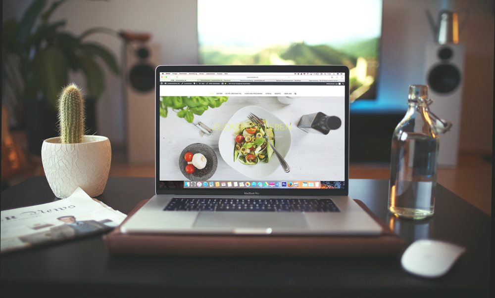 Laptop with graphic design of vegetable plate.