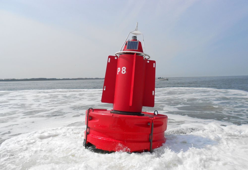 Red buoy in water.