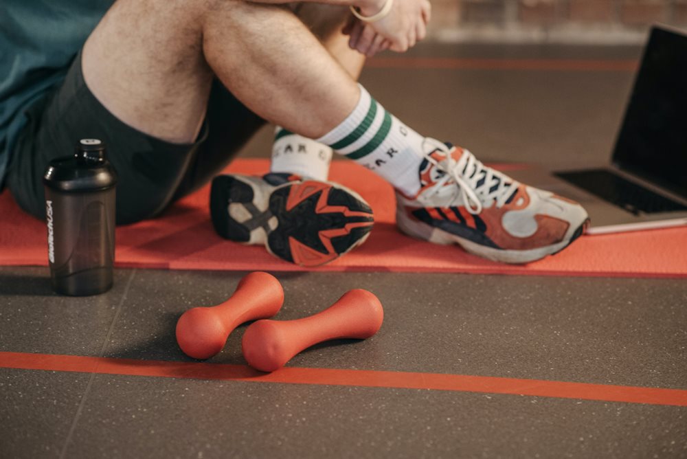 Small fitness weights lying on the floor.