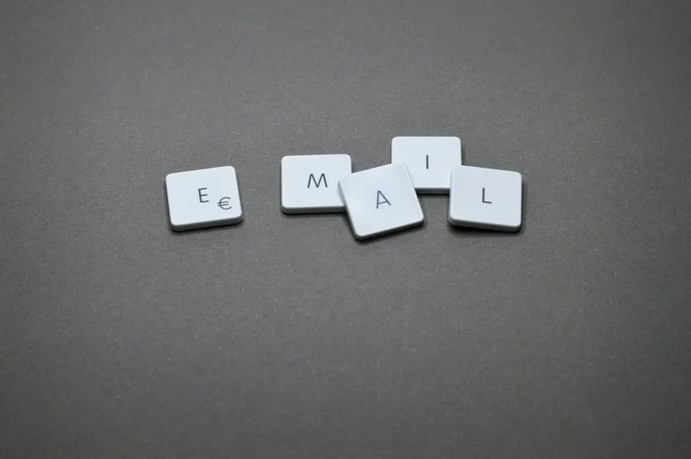 "Email" spelled with laptop key caps.