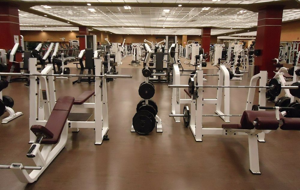 Spacy gym with lots of fitness equipment.