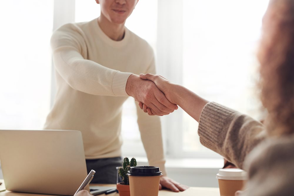 Handshake over desk.