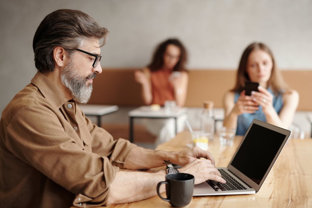 Guy typing on laptop, that is off.