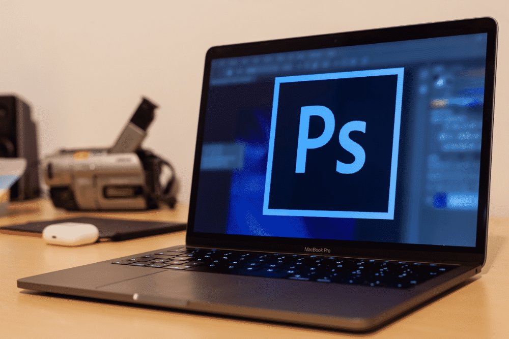 Photoshop logo on laptop.